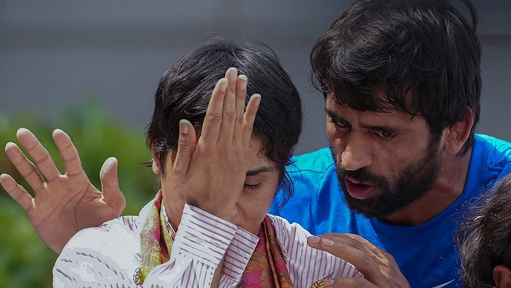 Wrestler Vinesh Phogat with wrestler Bajrang Punia - | Photo: PTI/Ravi Choudhary